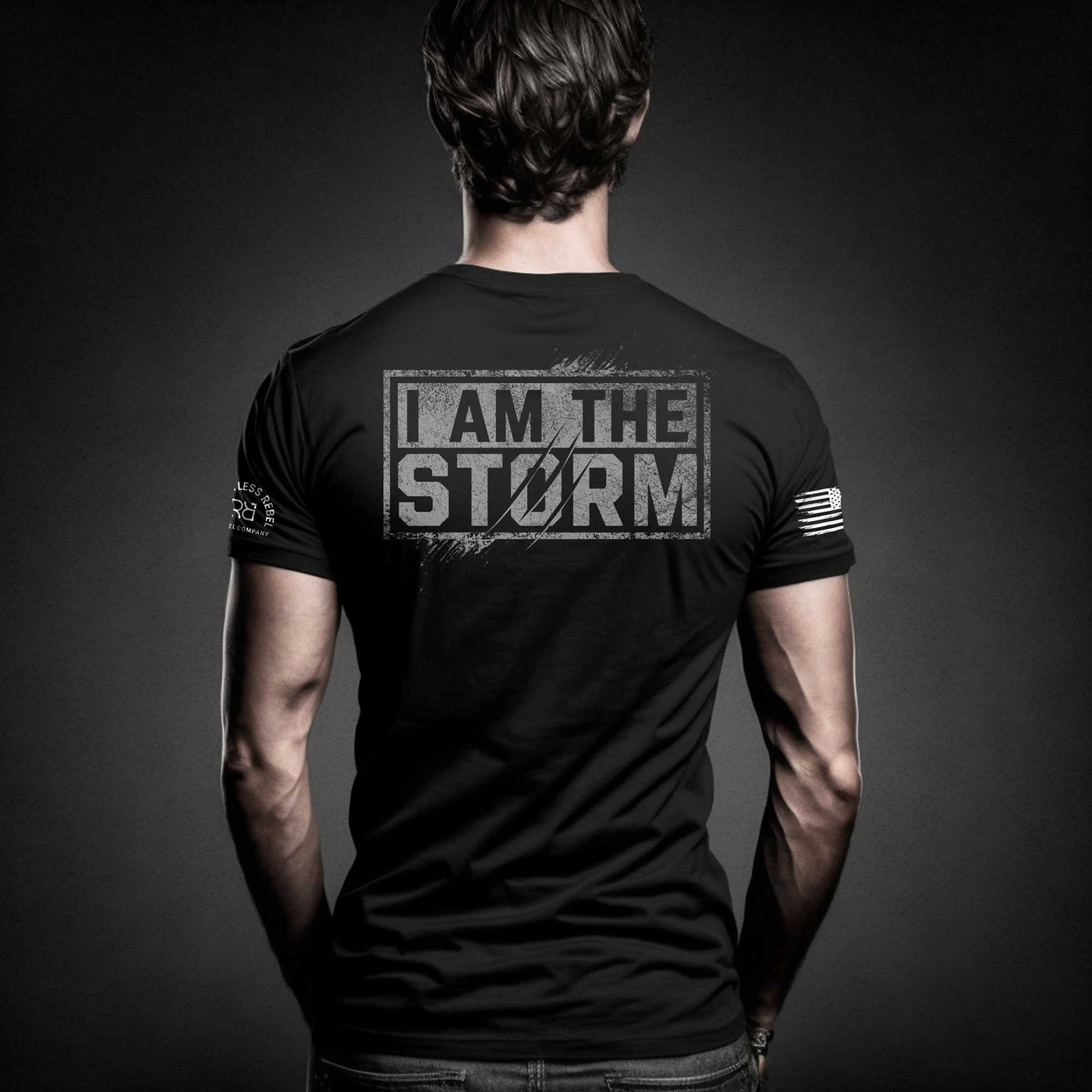 Man wearing Solid Black Men's I Am The Storm Back Design Tee