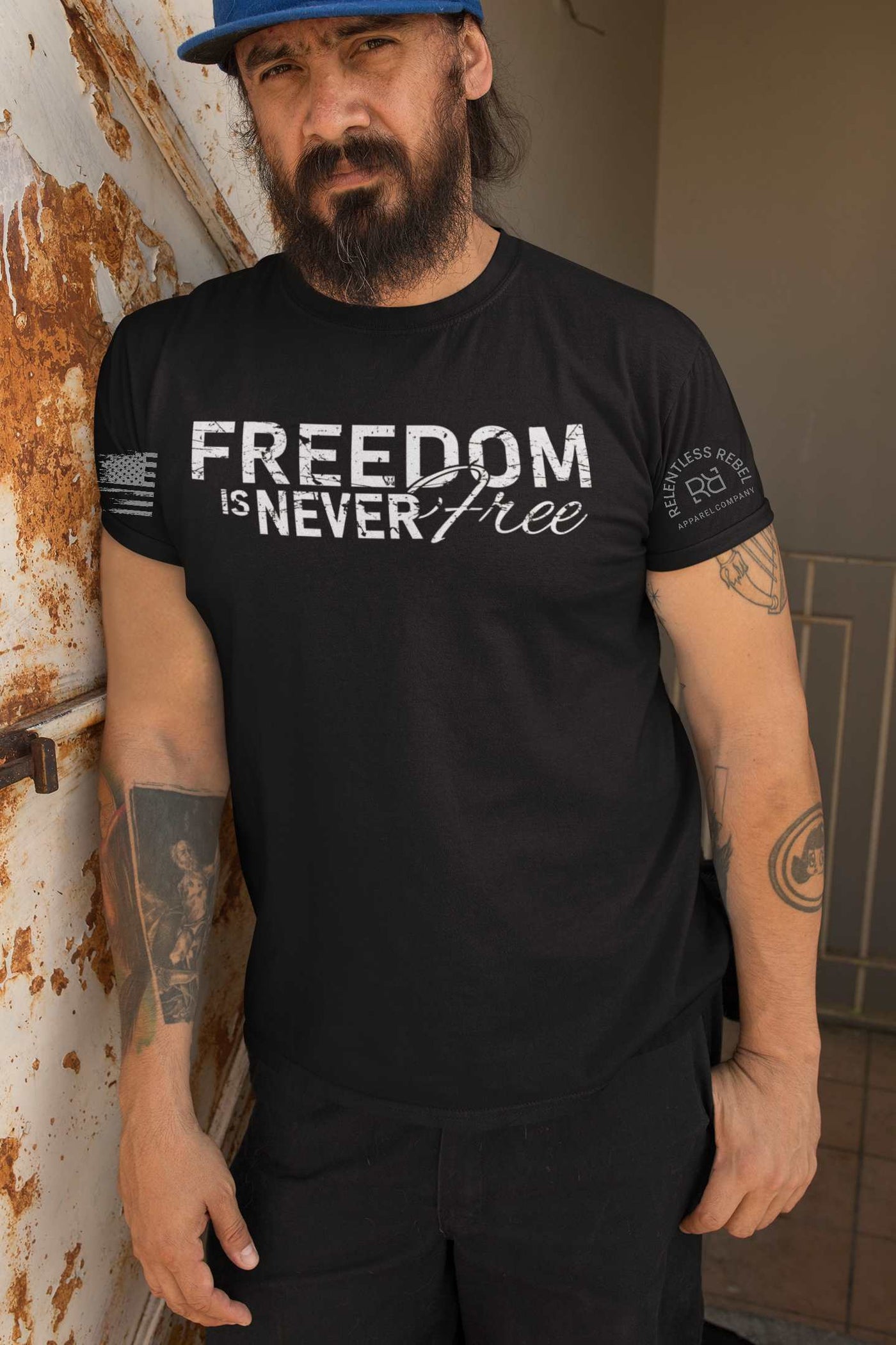 Man wearing Solid Black Men's Freedom Is Never Free Front Design Tee