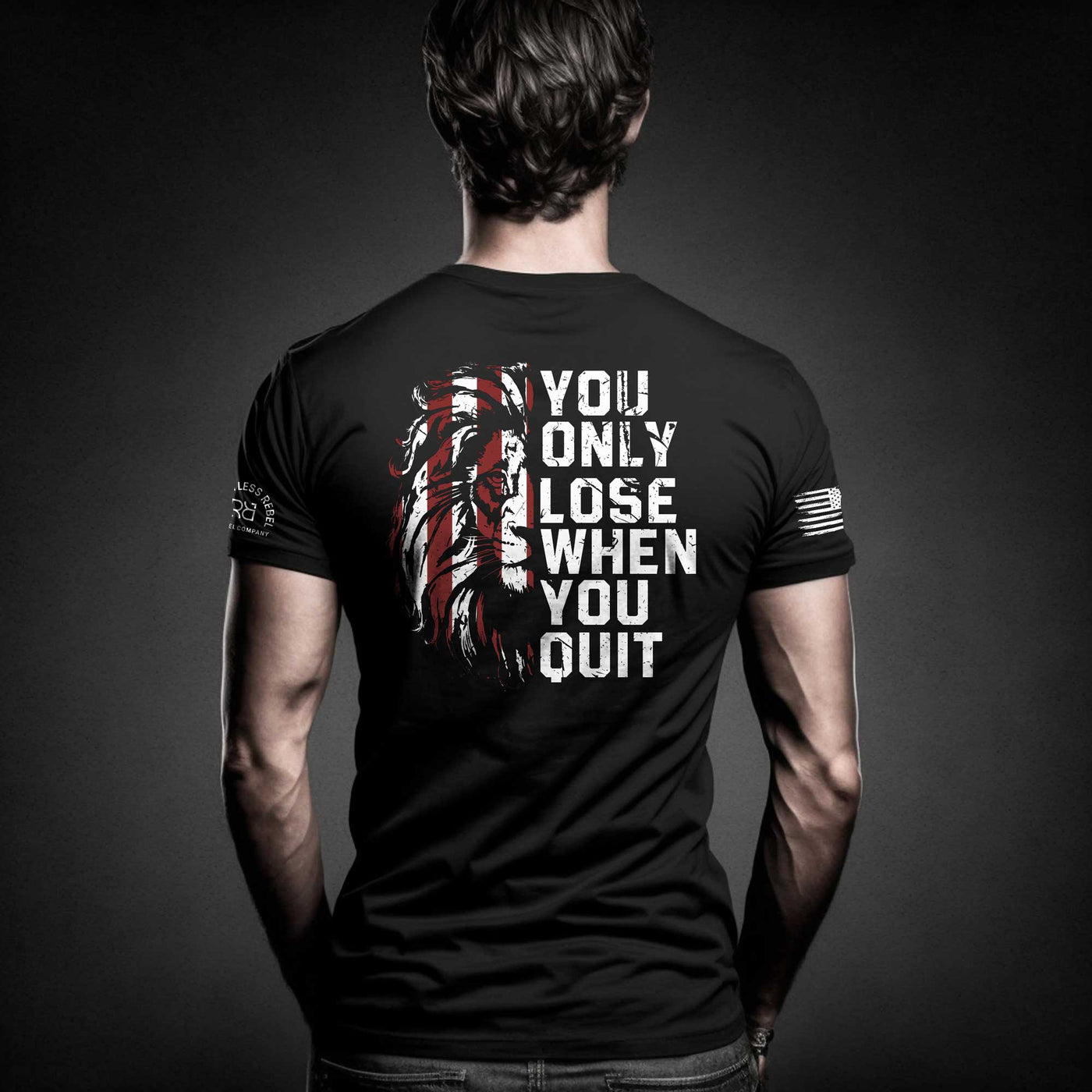 Man wearing Solid Black Men's You Only Lose When You Quit Back Design Tee