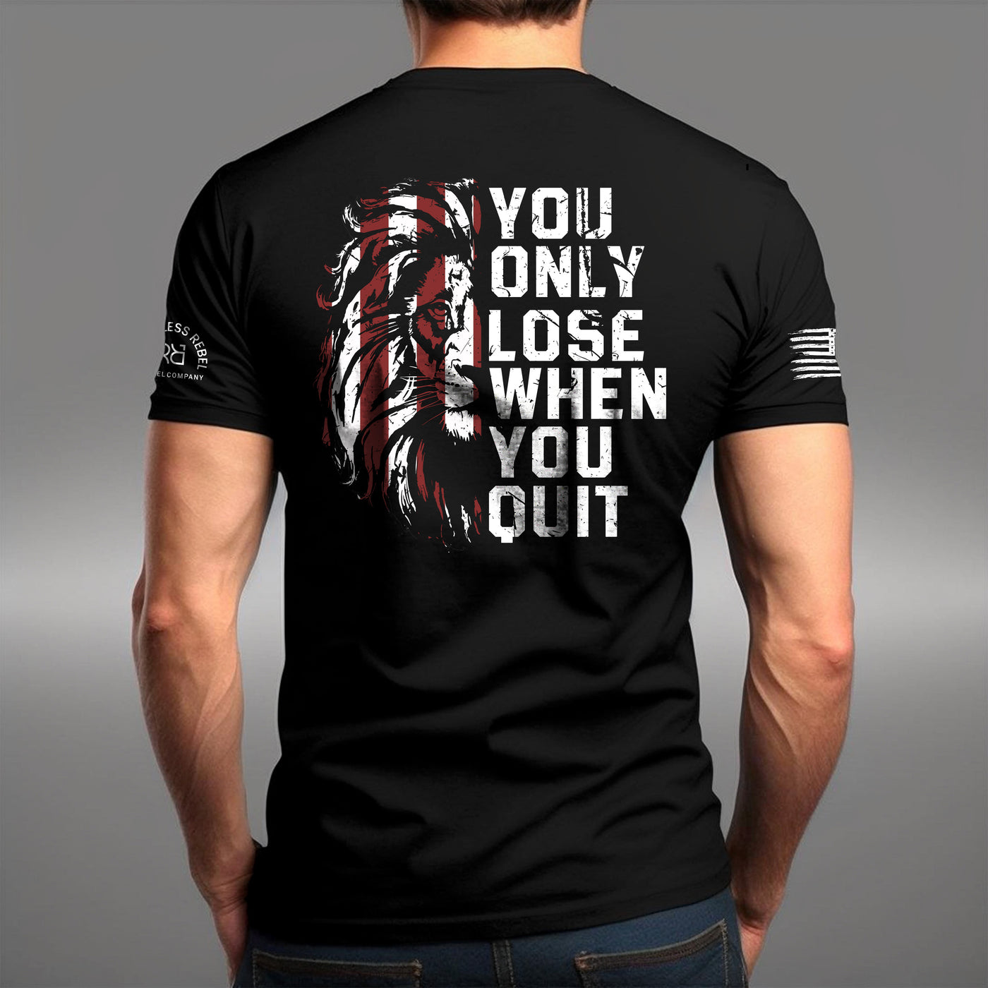 Man wearing Solid Black Men's You Only Lose When You Quit Back Design Tee